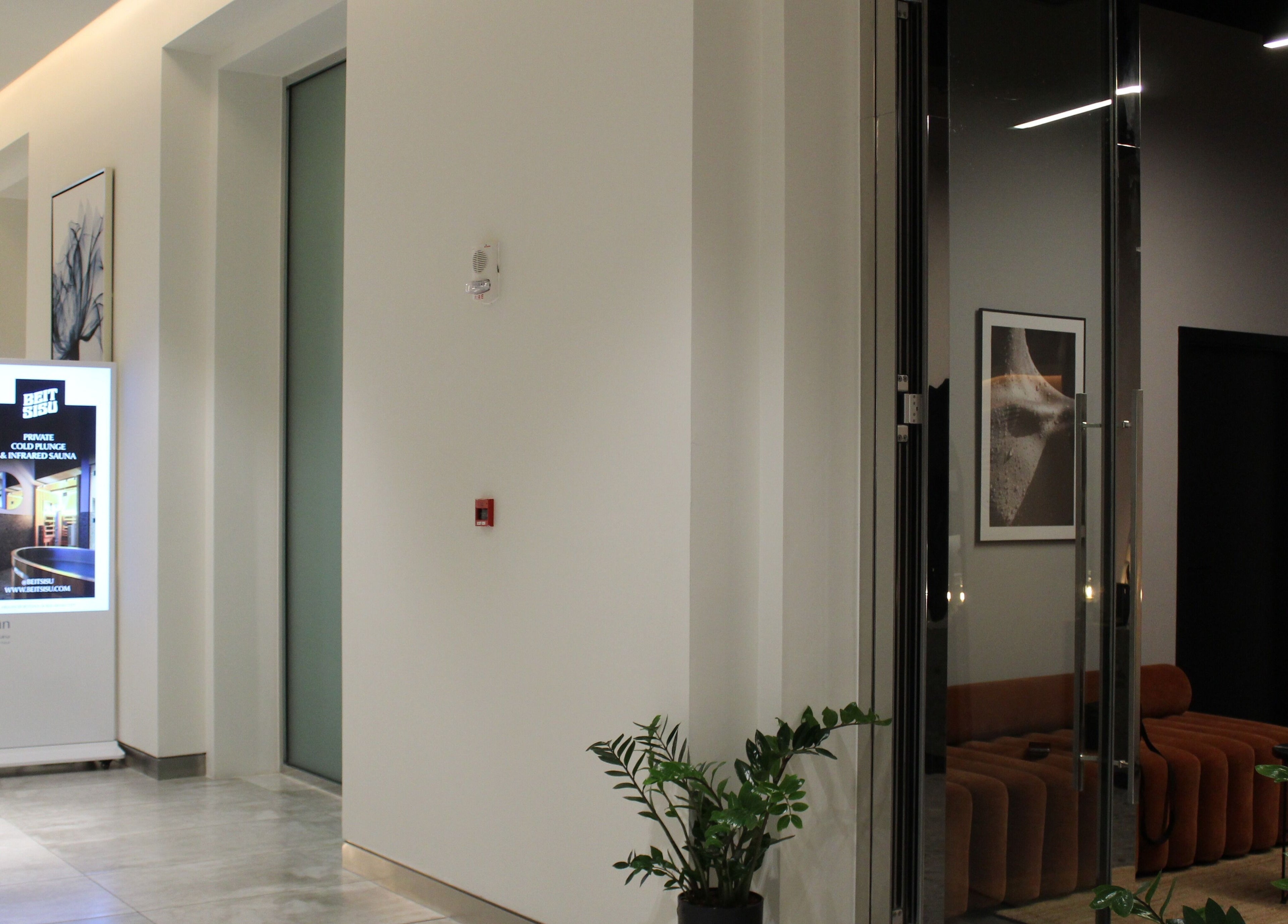 Stylish corner at Beit Sisu, Dubai, Dubai, AE featuring modern decor and sleek lighting.