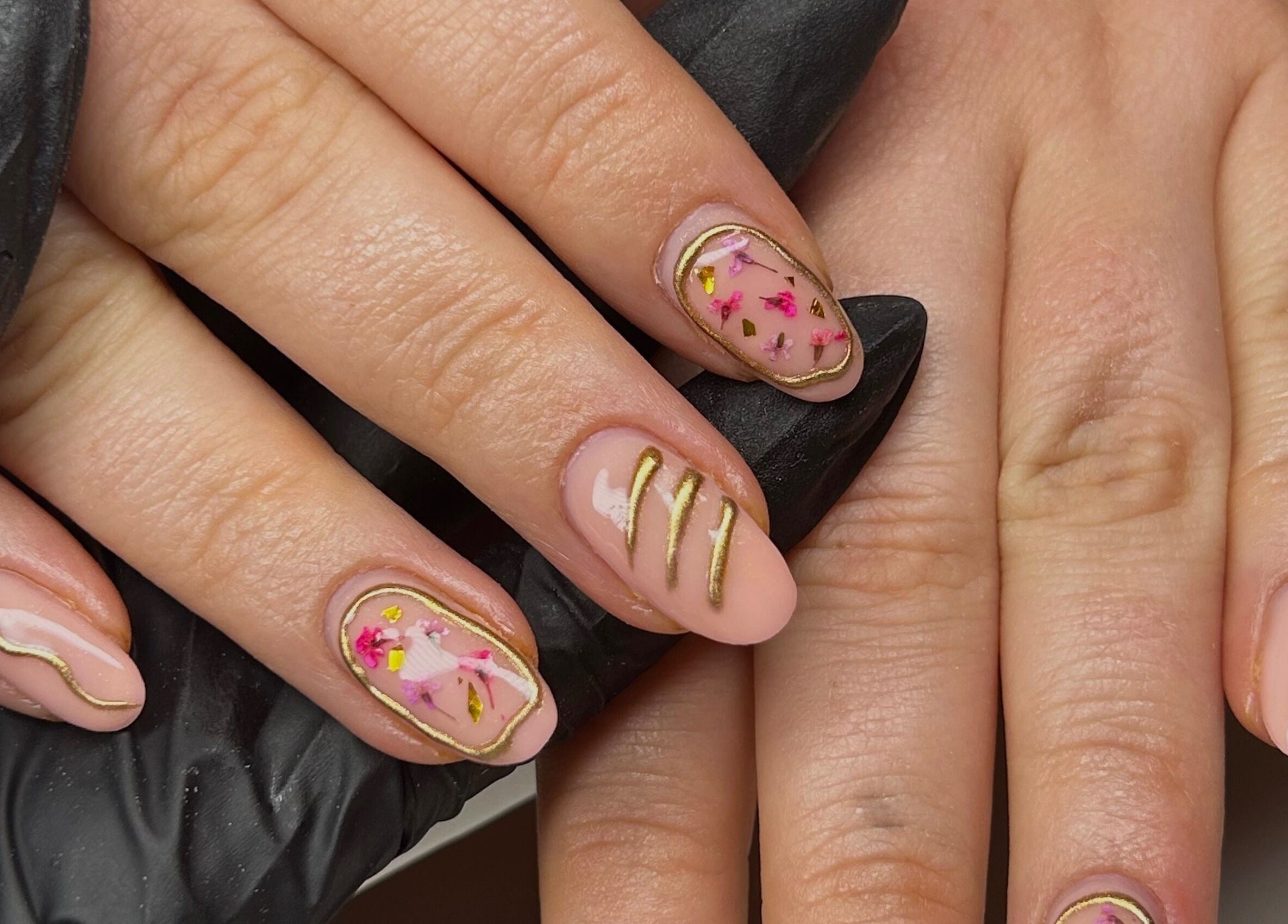 Elegant nail art with gold accents at Nailed It Bc, Hereford, England, GB.
