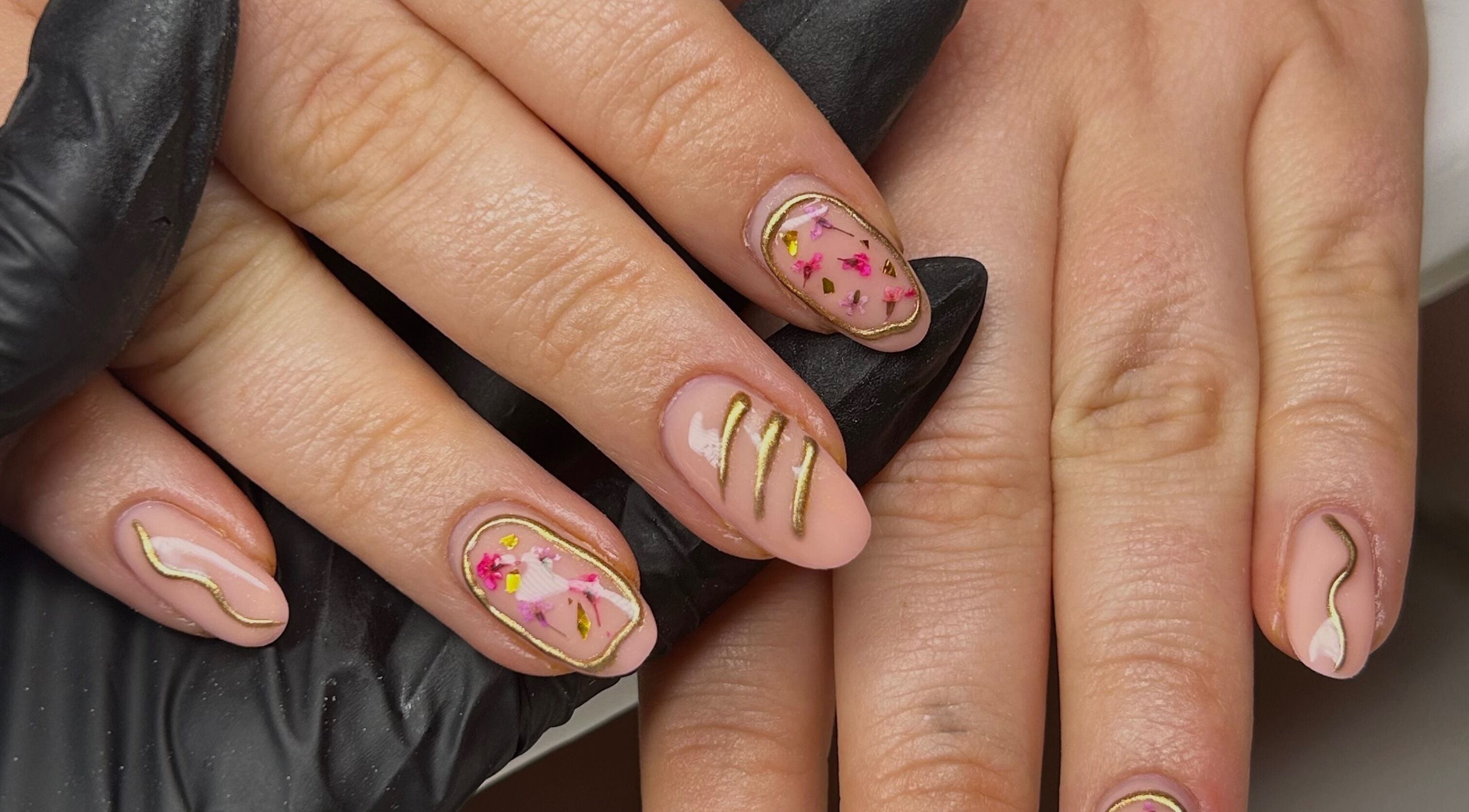 Elegant nail art with gold accents at Nailed It Bc, Hereford, England, GB.