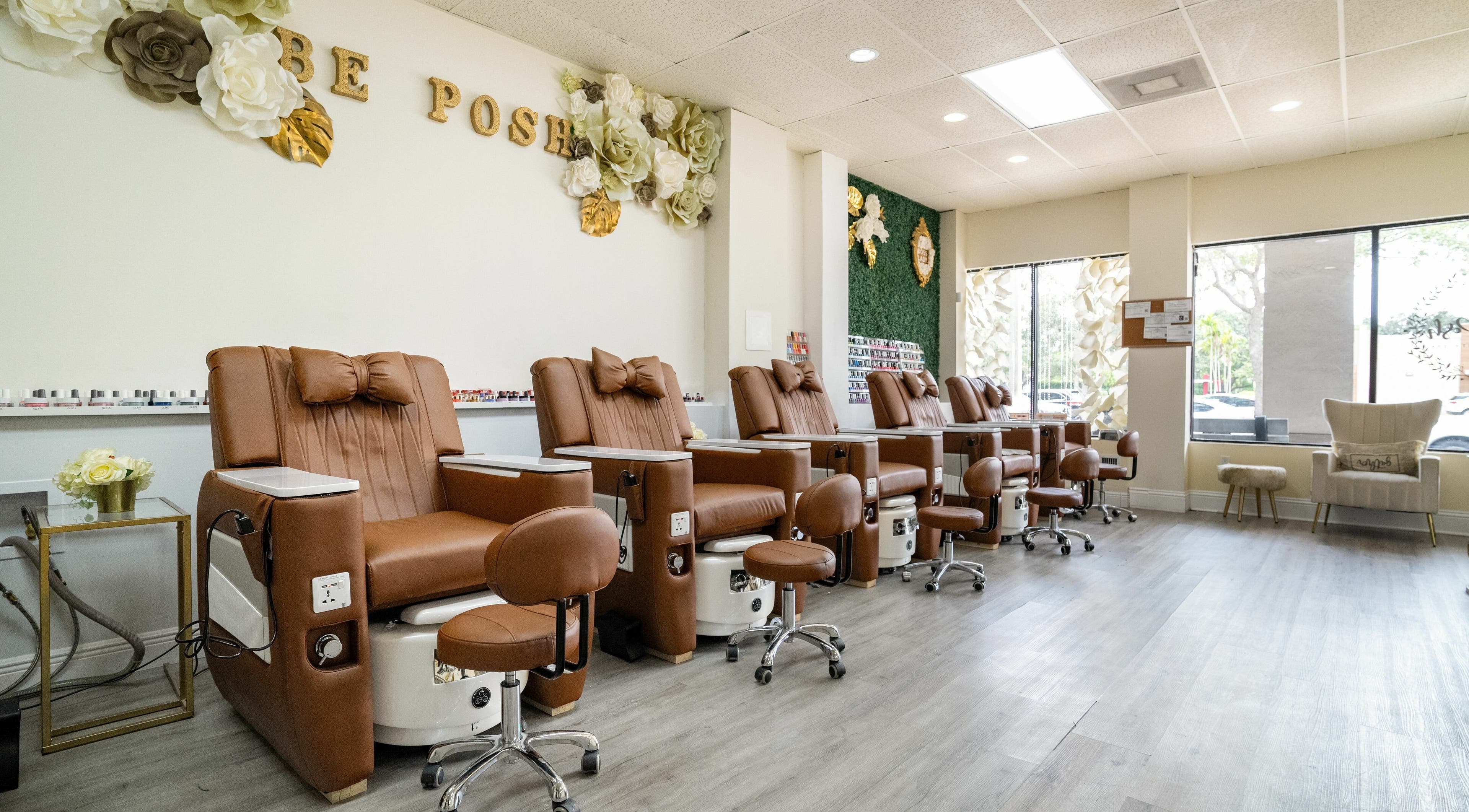 Elegant pedicure chairs at Be Posh Nails & Beauty Spa, Pembroke Pines, Florida, US, offering a serene ambiance.