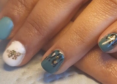 Stylish nail art at Raven Nails by Michélle, Roodepoort, Gauteng, ZA, featuring blue and white polish with gold accents.