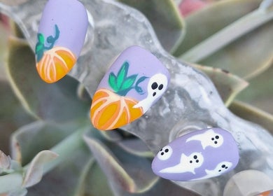 Halloween-themed nail art with pumpkins and ghosts at Raven Nails by Michélle, Roodepoort, Gauteng, ZA.