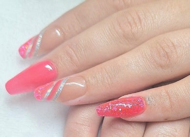 Vibrant pink nails with glitter at Raven Nails by Michélle, Roodepoort, Gauteng, ZA showcasing elegance.