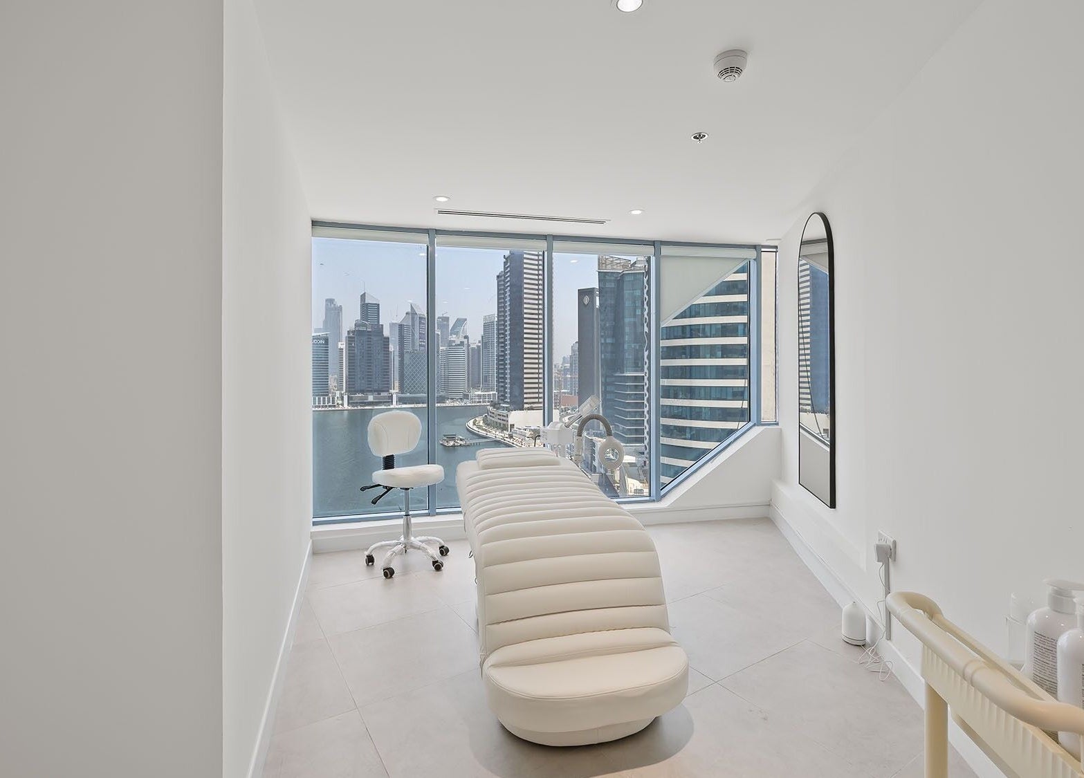 Luxurious treatment room at Nush Skincare Dubai with stunning skyline views, located in Dubai, Dubai, AE.