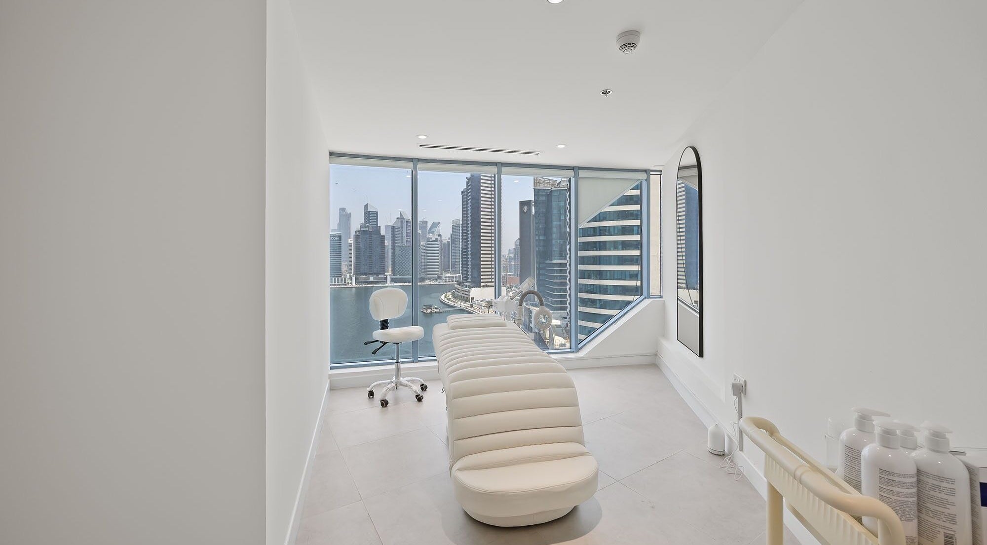 Luxurious treatment room at Nush Skincare Dubai with stunning skyline views, located in Dubai, Dubai, AE.