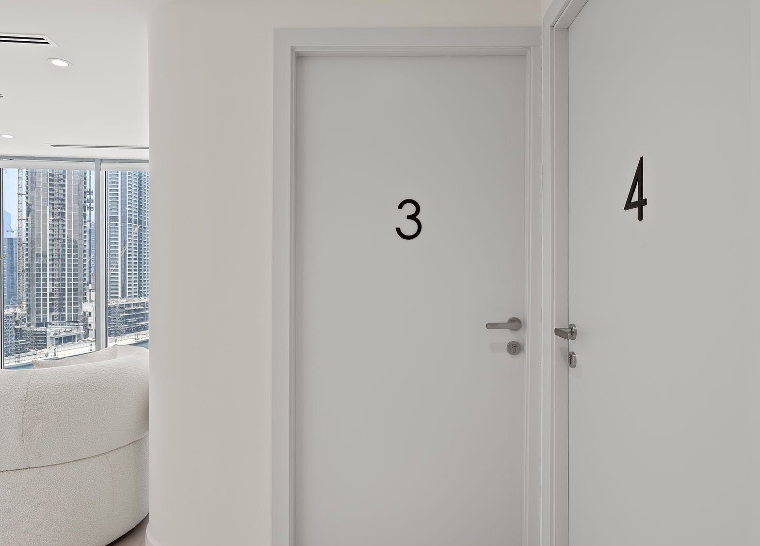 Sleek doors at Nush Skincare Dubai overlook cityscape from chic interior, Dubai, Dubai, AE.