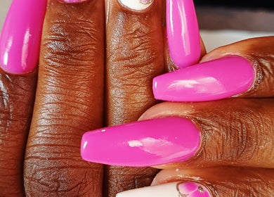Bright pink manicured nails at Nomsa's Nails and Beauty, Midrand, Gauteng, ZA showcasing elegance and style.