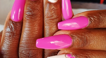 Bright pink manicured nails at Nomsa's Nails and Beauty, Midrand, Gauteng, ZA showcasing elegance and style.