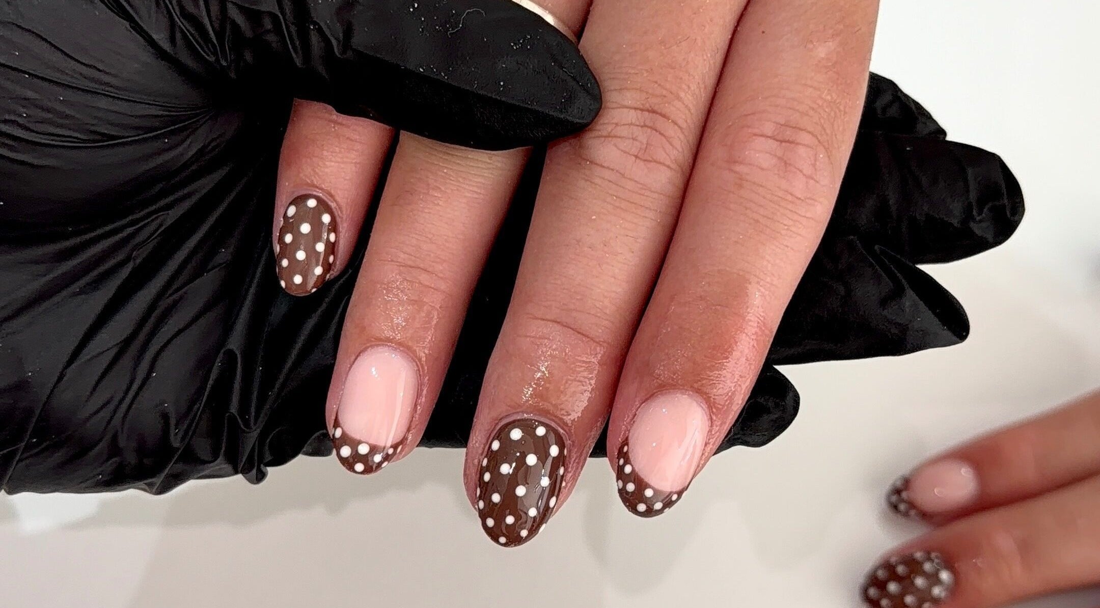 Polka dot nail art manicure at Beauty By Leah, Skewen, Wales, GB. Stylish design with nude and chocolate tones.