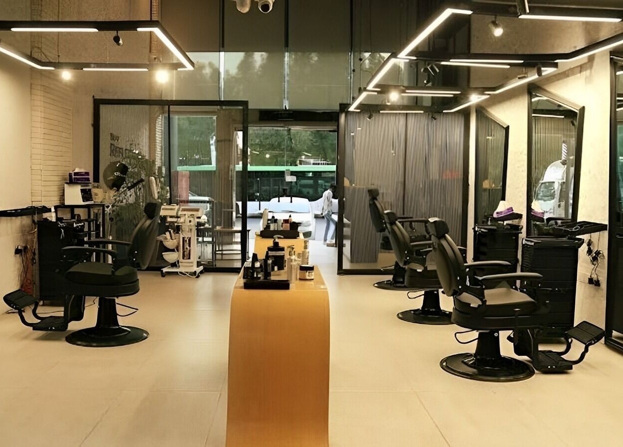 Contemporary interior of Self Reflection Barbershop, الرياض, منطقة الرياض, SA, with sleek barber chairs.