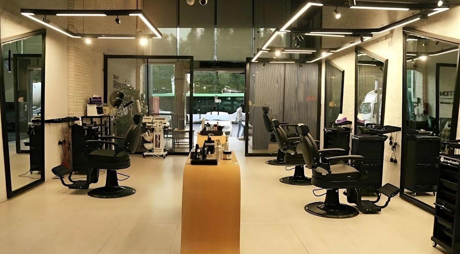 Contemporary interior of Self Reflection Barbershop, الرياض, منطقة الرياض, SA, with sleek barber chairs.