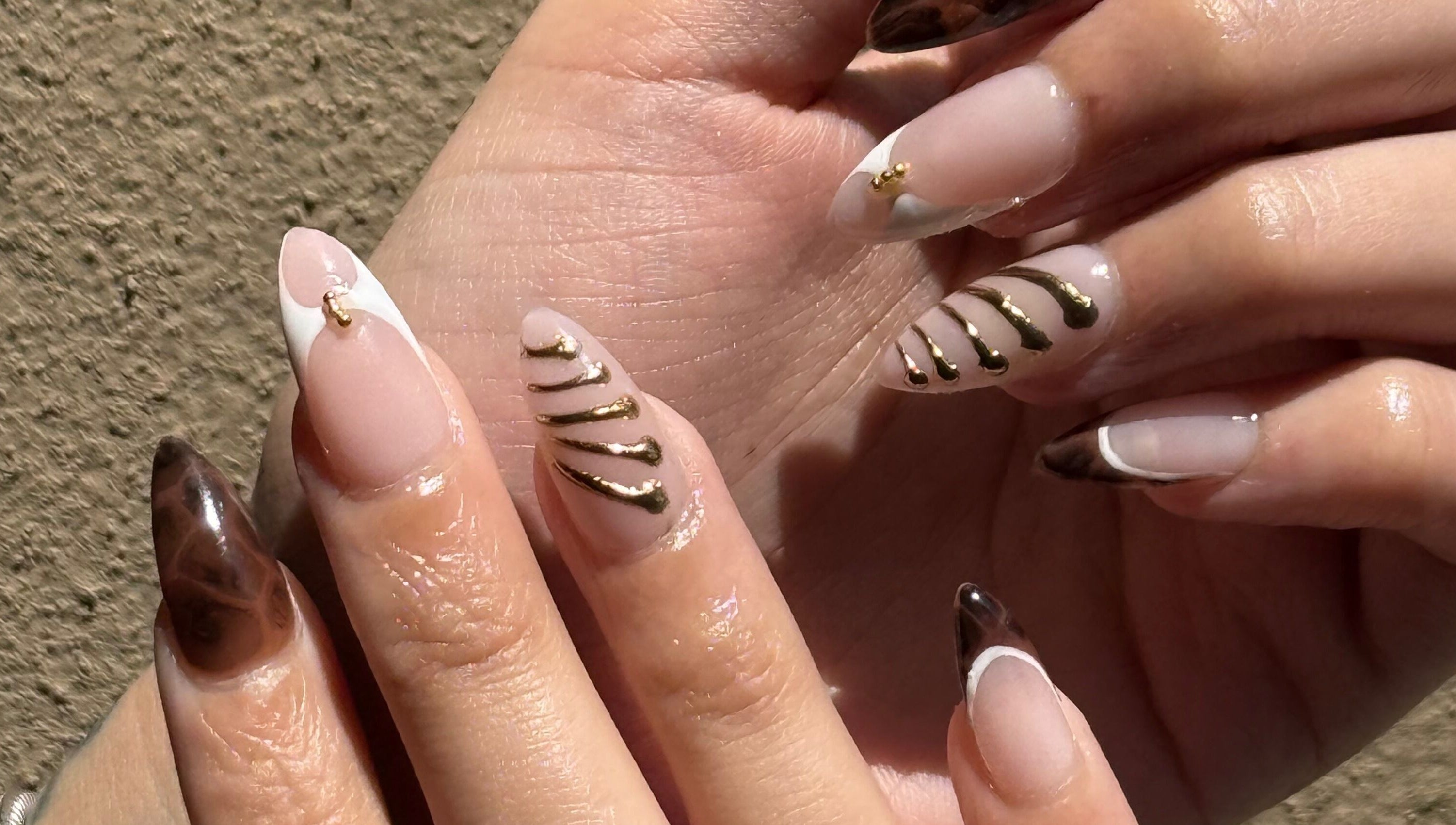 Elegant nail art with gold accents by Nails by Teri in Queensburgh, Kwazulu-natal, ZA.