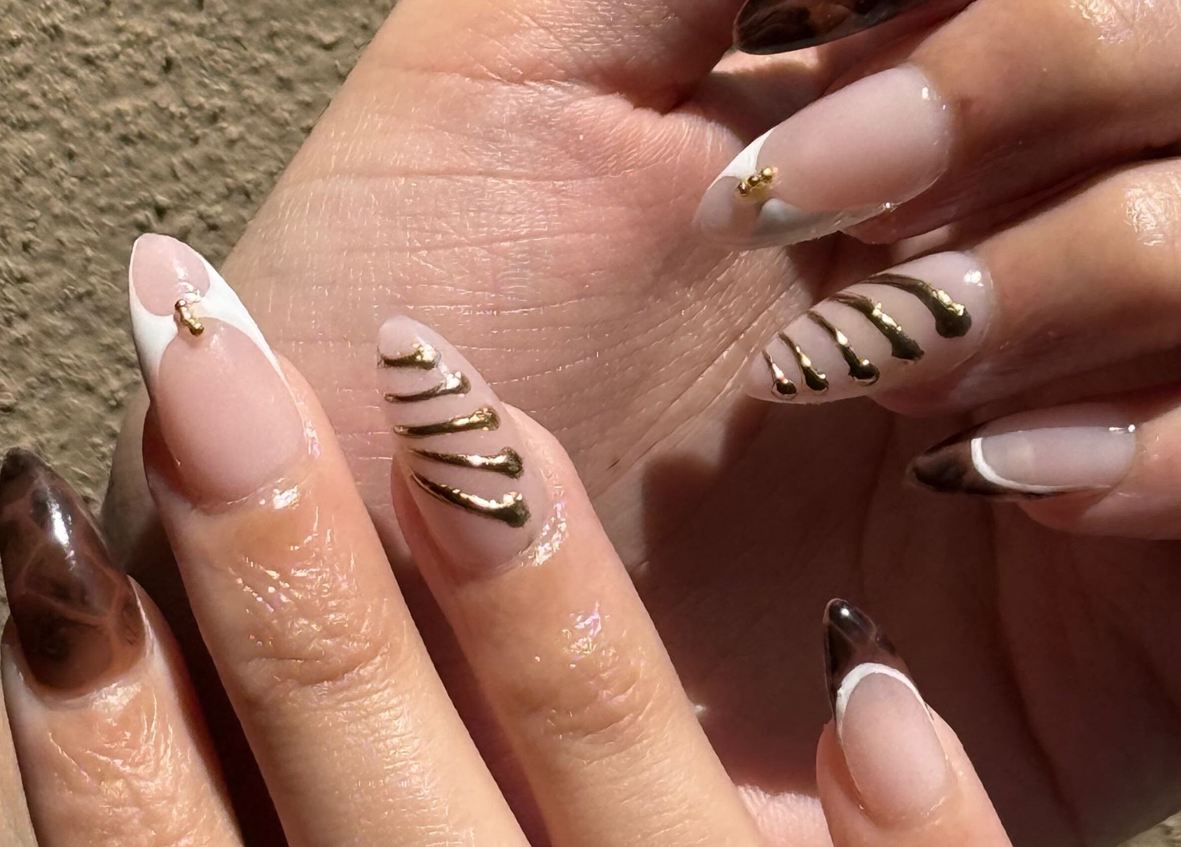 Elegant nail art with gold accents by Nails by Teri in Queensburgh, Kwazulu-natal, ZA.