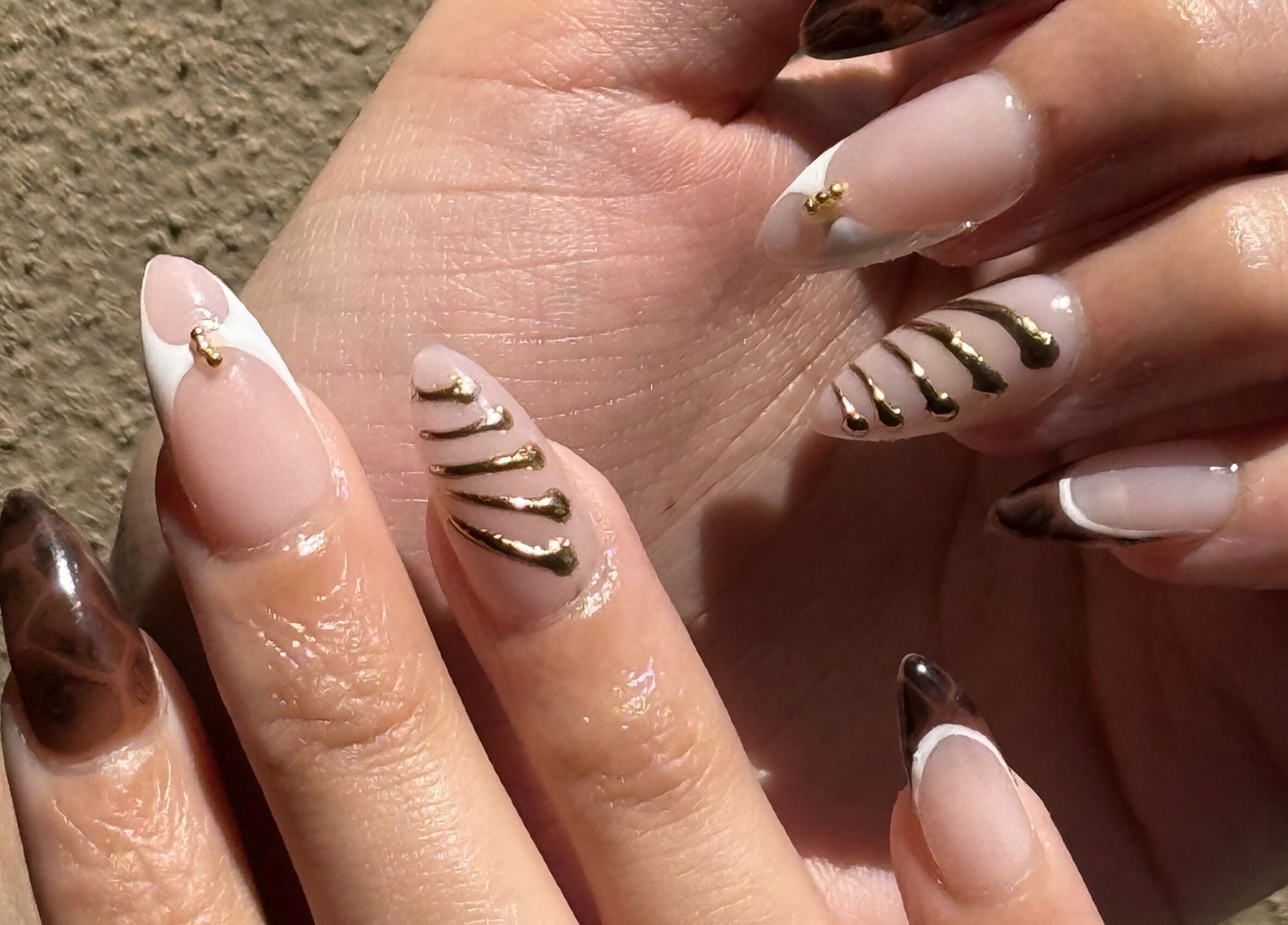 Elegant nail art with gold accents by Nails by Teri in Queensburgh, Kwazulu-natal, ZA.