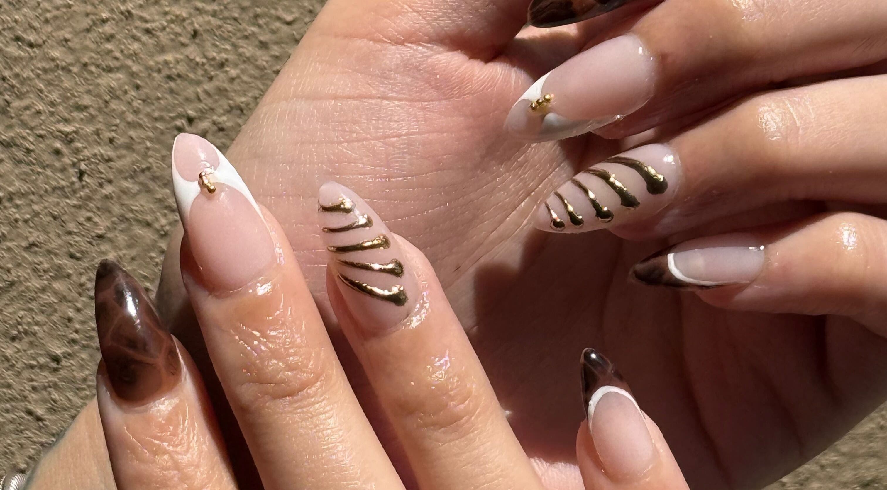 Elegant nail art with gold accents by Nails by Teri in Queensburgh, Kwazulu-natal, ZA.