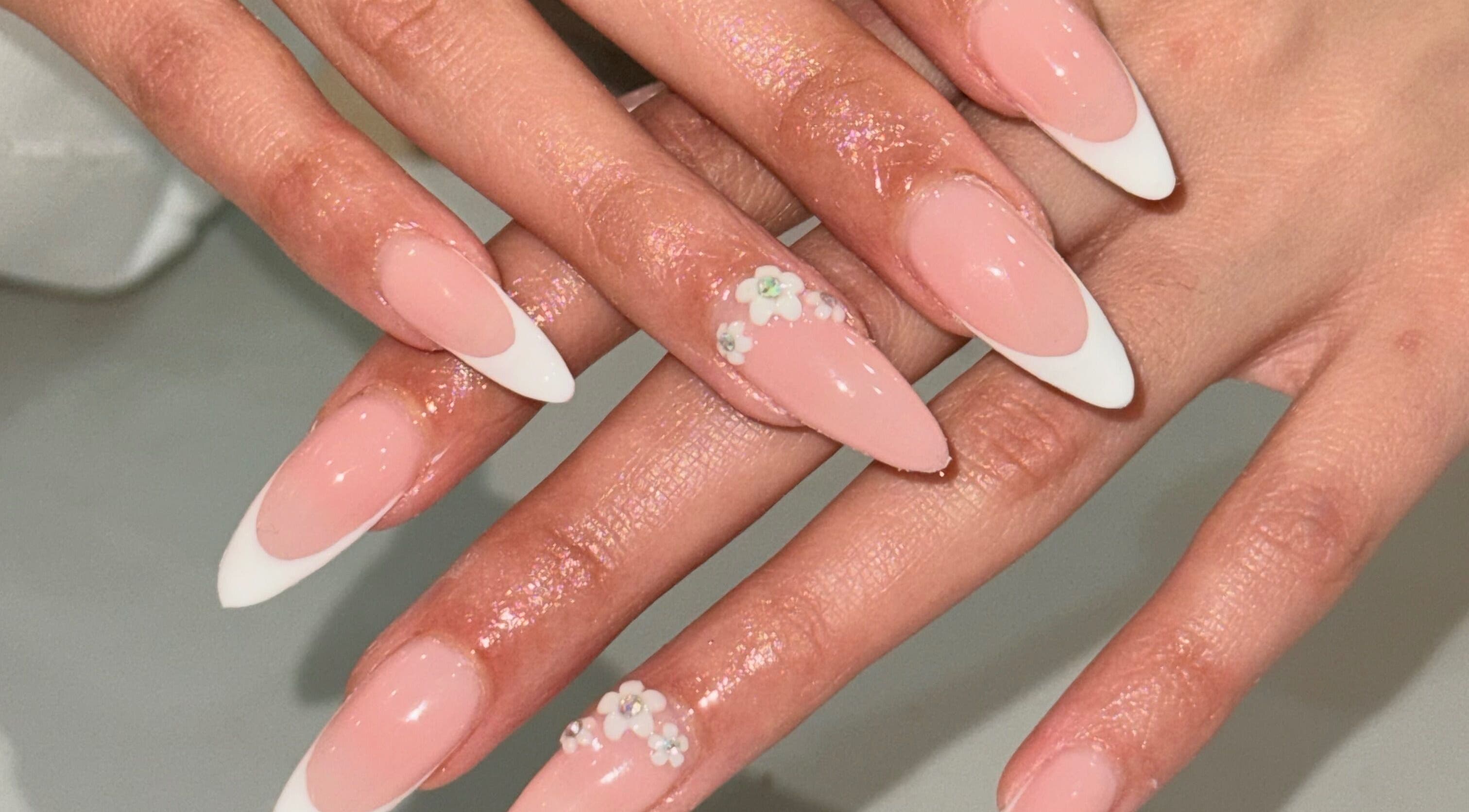 Elegant floral nail art with French tips at Nails by Teri, Queensburgh, Kwazulu-natal, ZA.