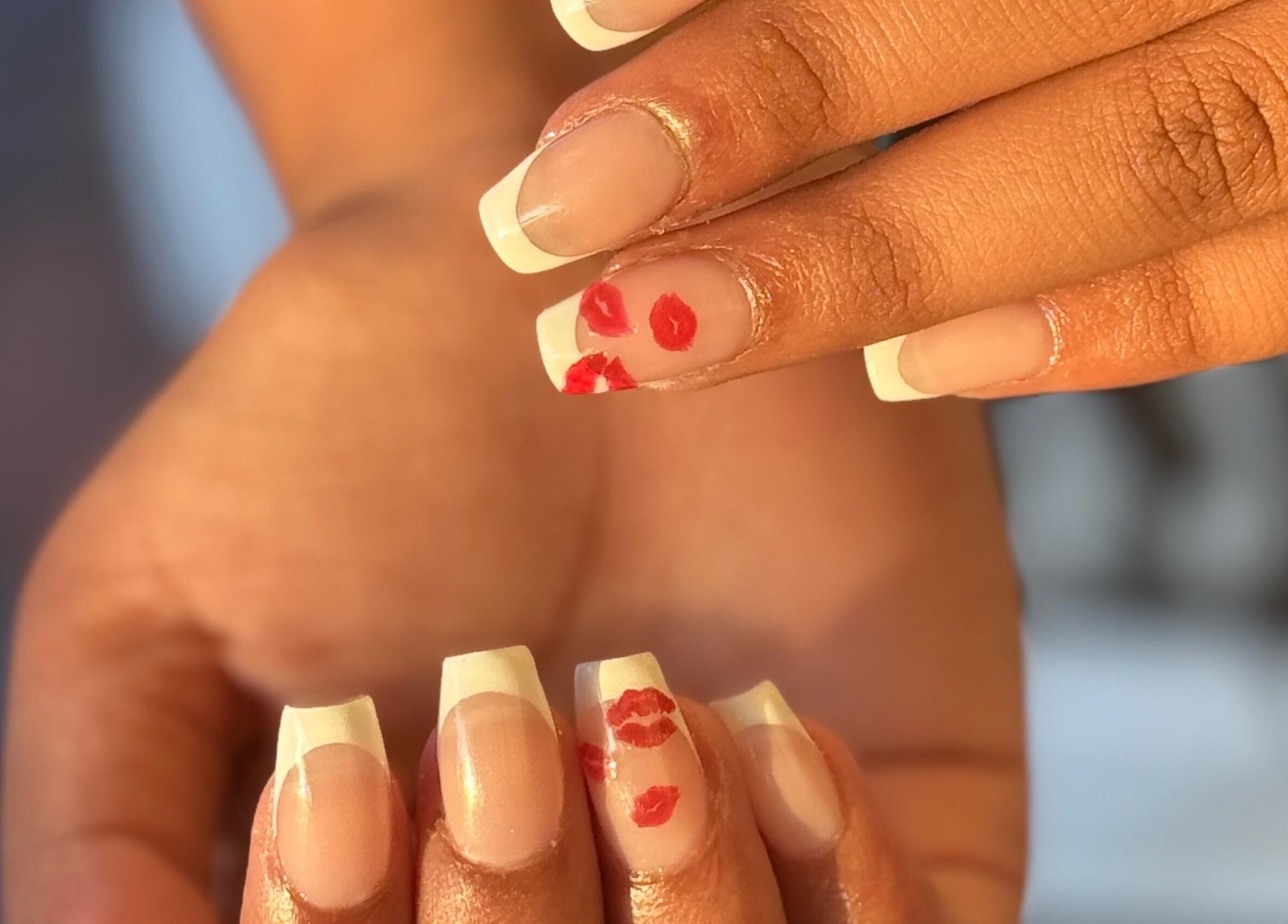 Elegant French manicure with kiss art by Nails by Teri in Queensburgh, Kwazulu-natal, ZA.