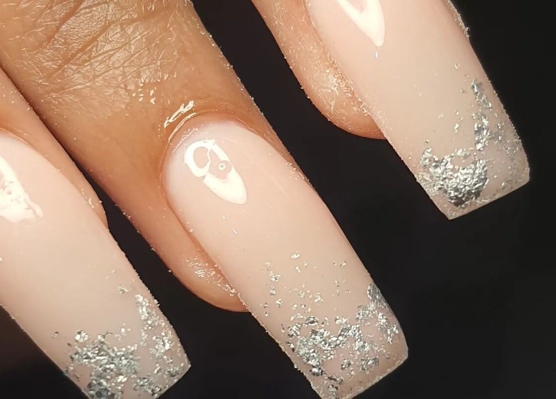Glamorous nude nails with silver glitter at Nails by Teri, Queensburgh, Kwazulu-natal, ZA.