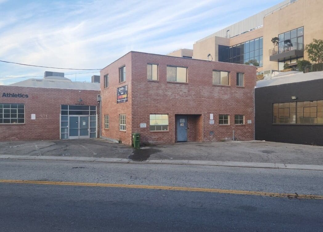 Front view of VitaKinesis - movement is life, a brick building in Los Angeles, California, US.