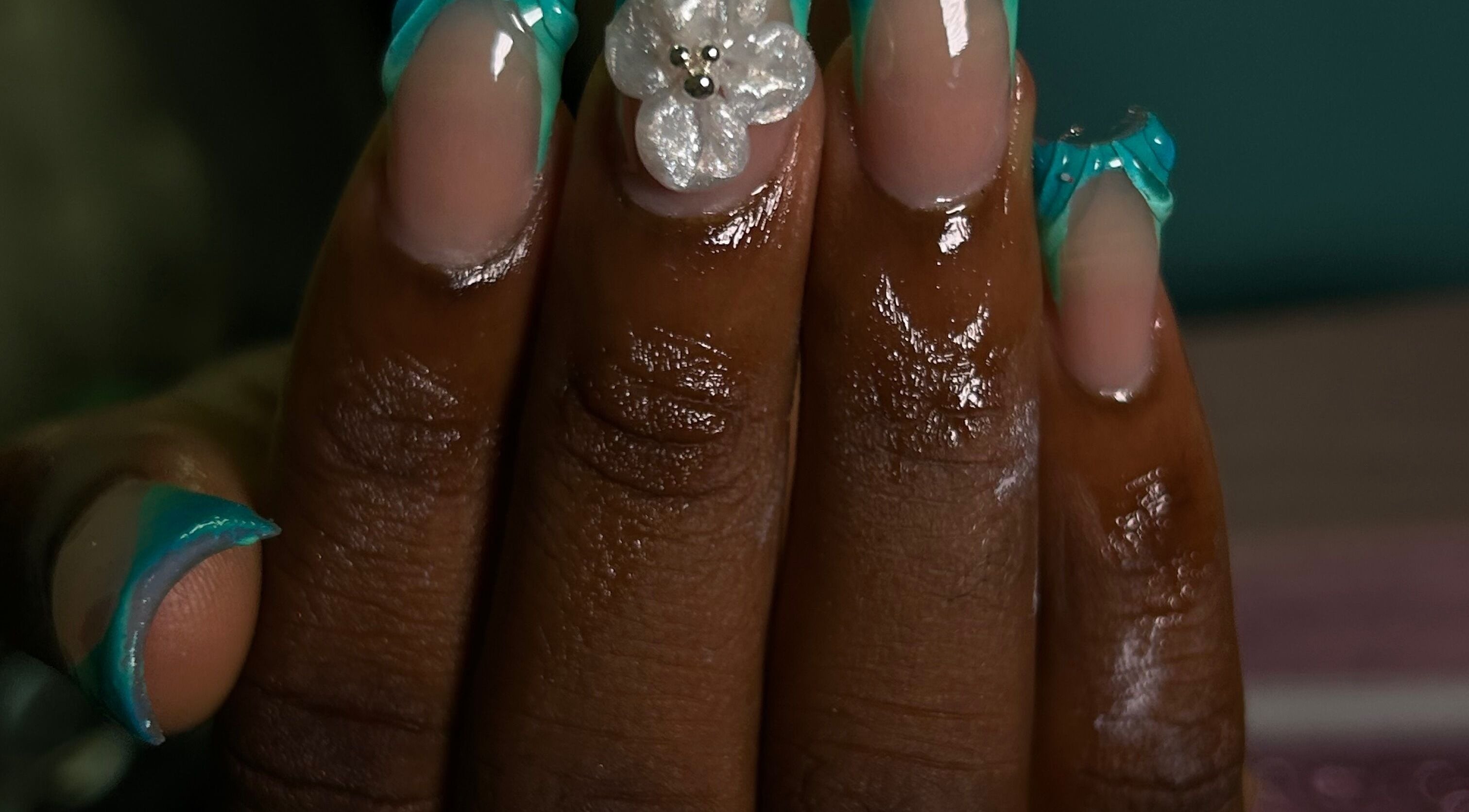 Elegant aqua acrylic nails with floral design at She Buffed It, Nassau, New Providence, BS.