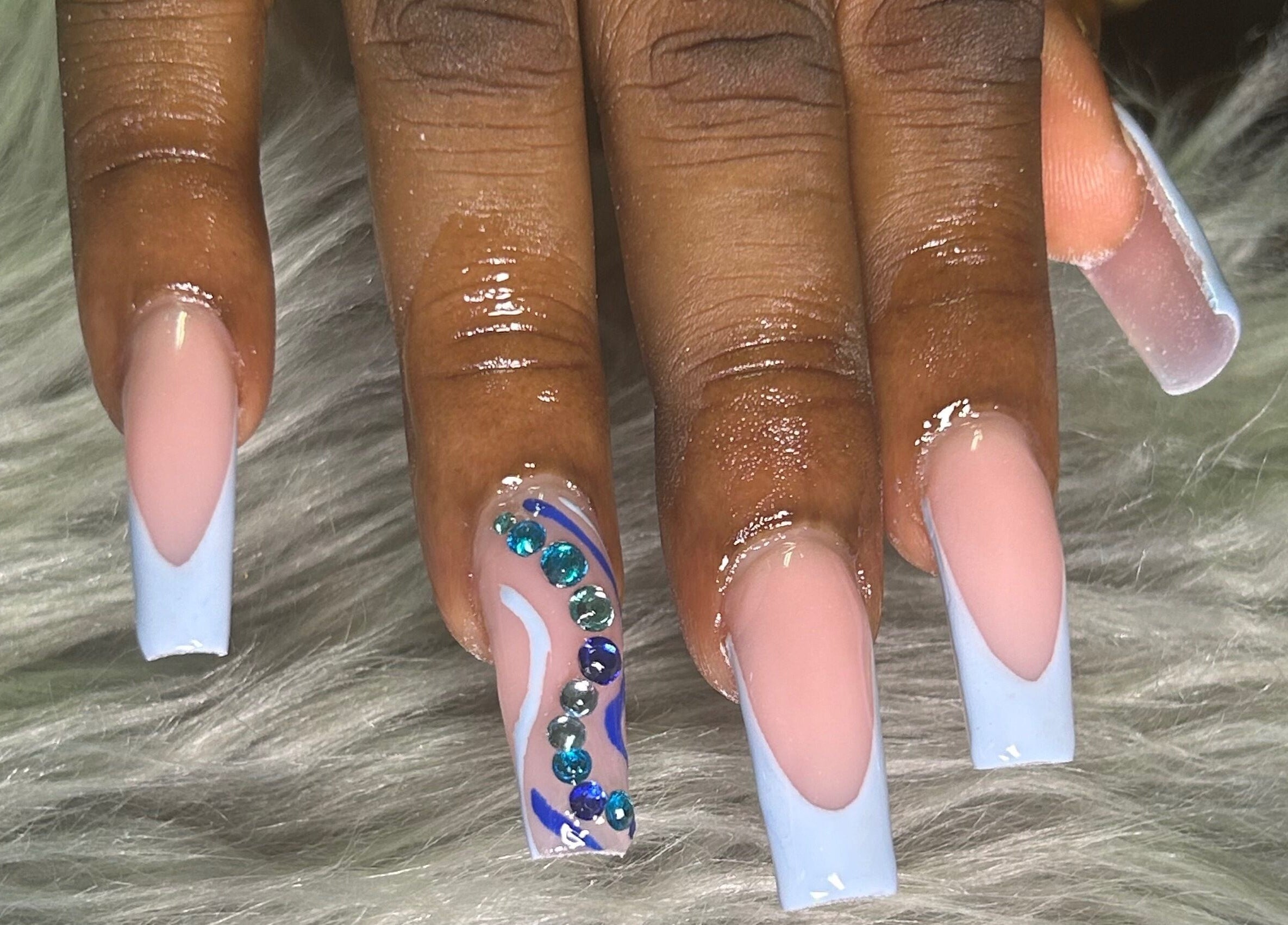 Elegant nail art with gemstones at She Buffed It, Nassau, New Providence, BS.