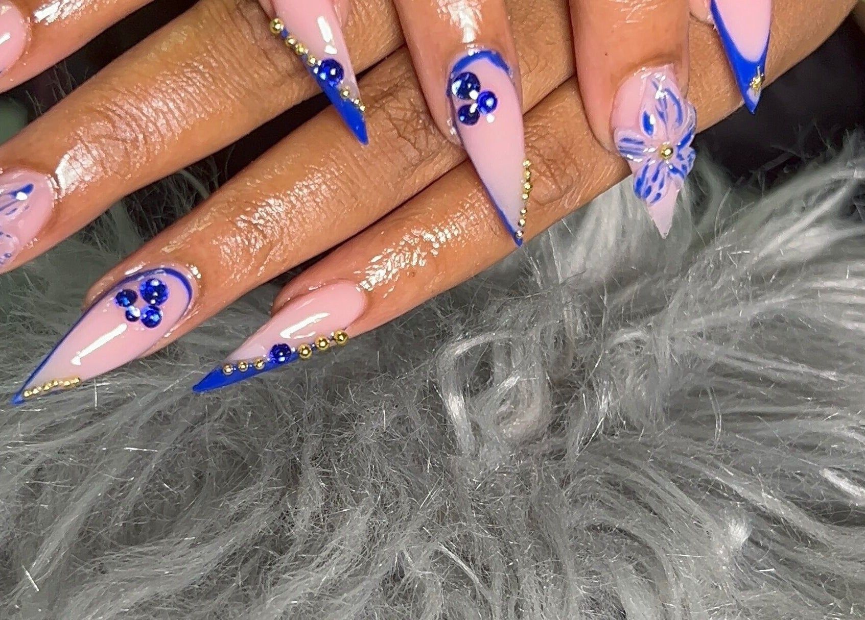 Intricate blue floral nail art at She Buffed It, Nassau, New Providence, BS.