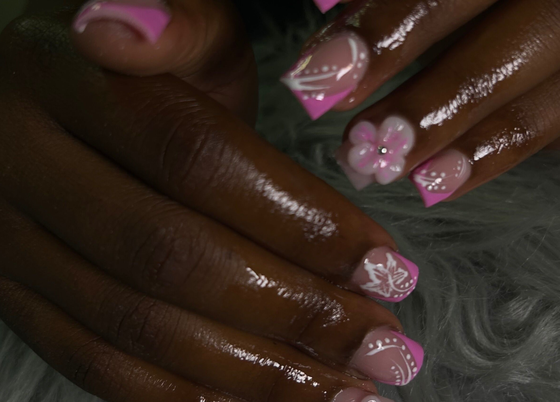 Elegant pink floral nails at She Buffed It, Nassau, New Providence, BS, showcasing expert manicure design.
