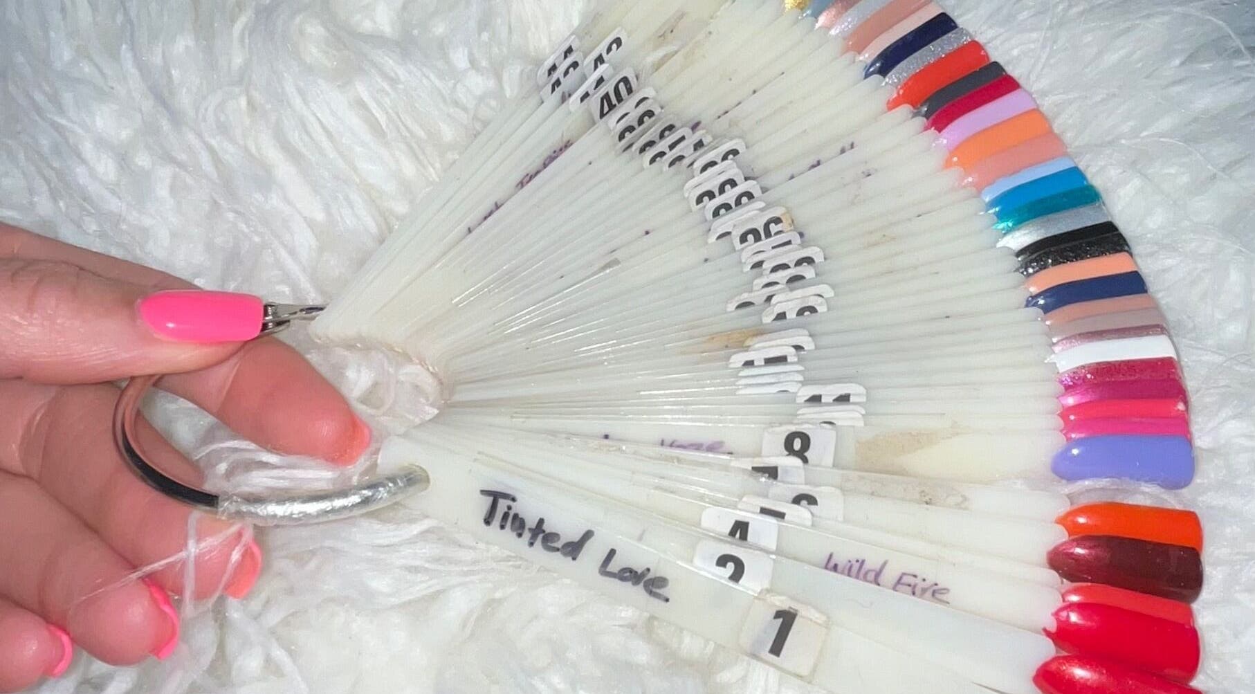 Variety of nail polish samples on ring at Venus Vegan, London, England, GB for color selection.