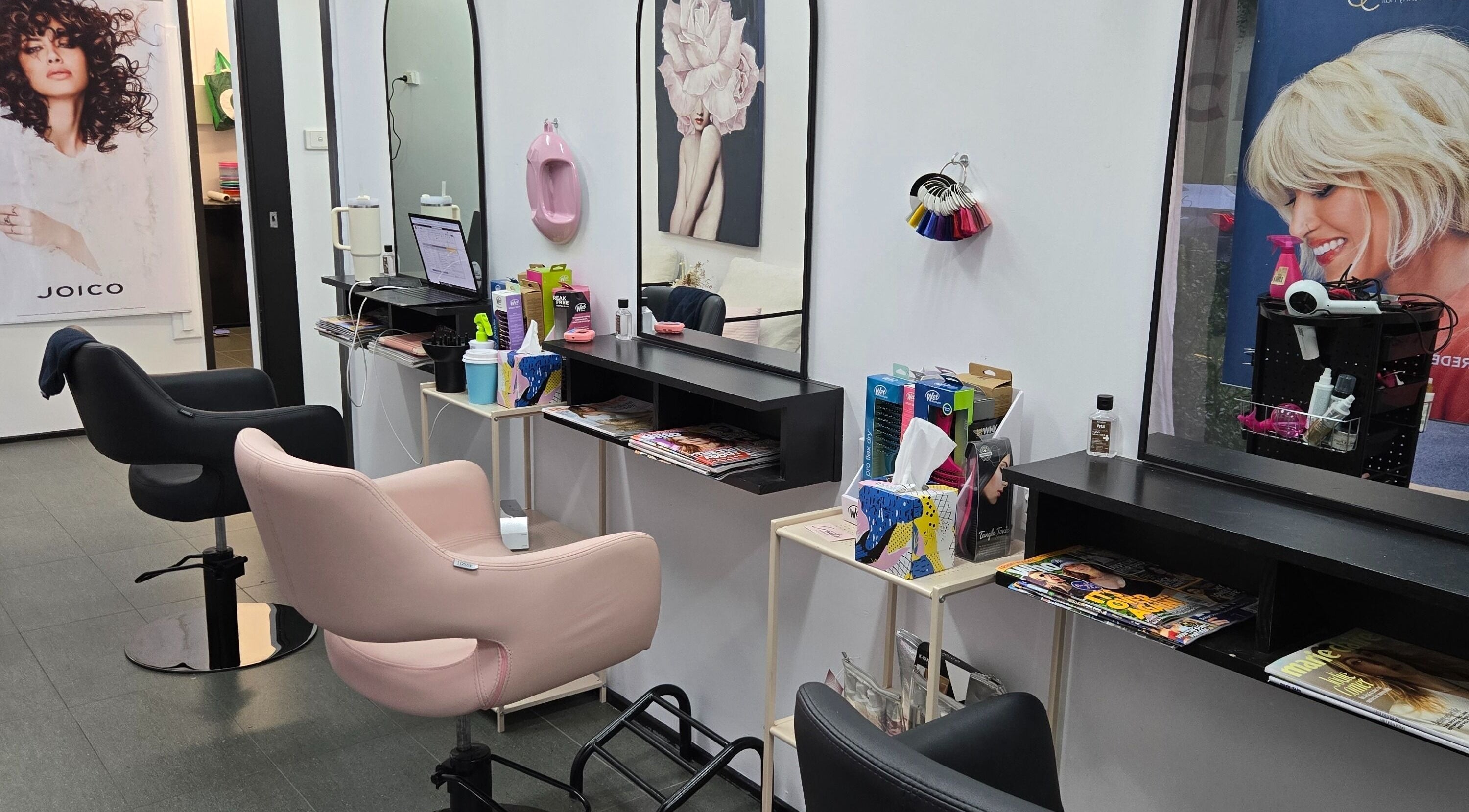 Modern salon seating and styling area at Rita at Create Hair & Co, Corrimal, New South Wales, AU.