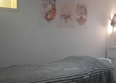 Serene therapy room at Holisticlisa in Douglas, Onchan, IM with calming décor and soft lighting.