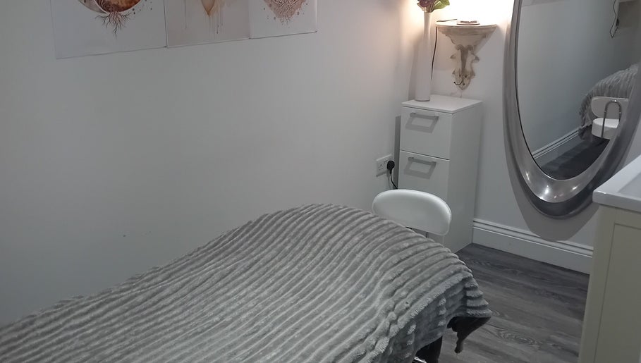 Tranquil treatment room at Holisticlisa, Douglas, Onchan, IM with soft lighting and soothing decor.