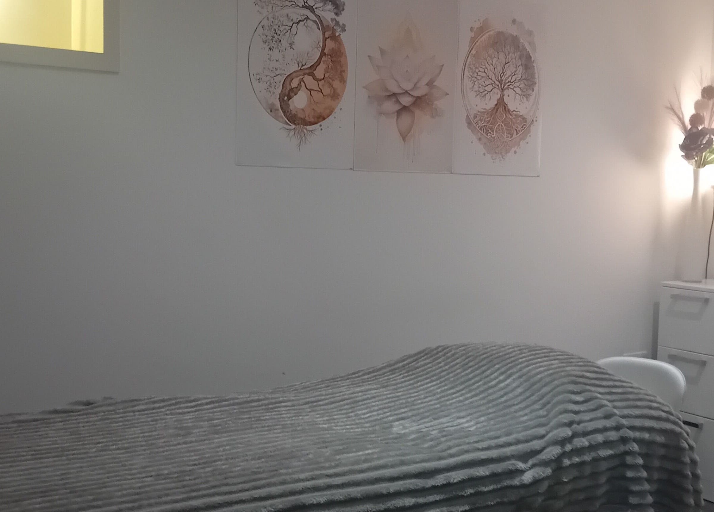 Cozy treatment room at Holisticlisa in Douglas, Onchan, IM with soft lighting and calming decor.
