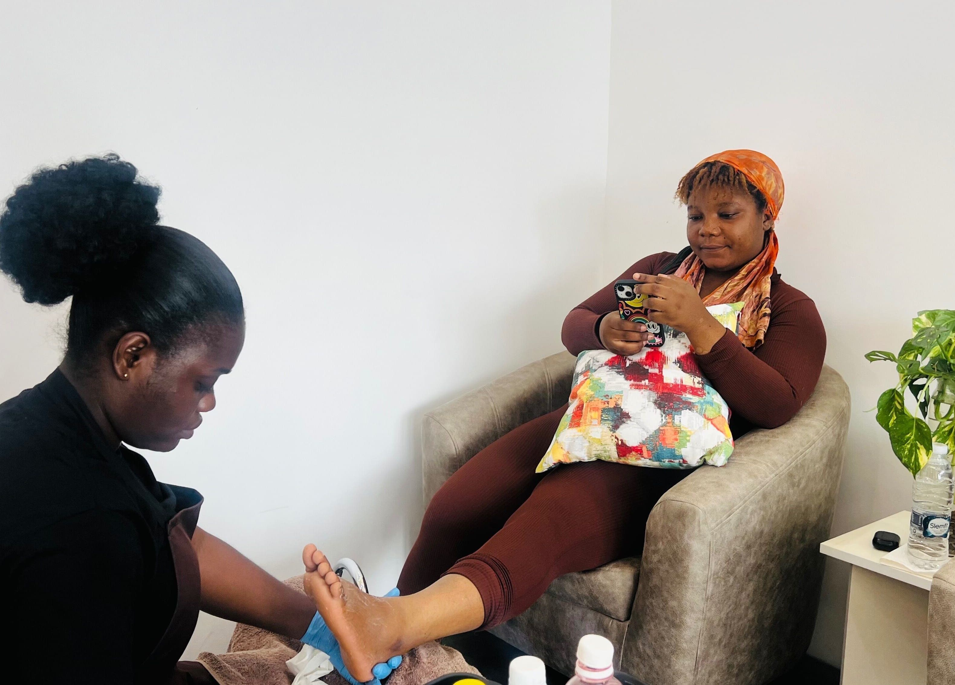 Woman enjoying a pedicure at Ronexe Beauty Hub in Greater Accra Region, GH.