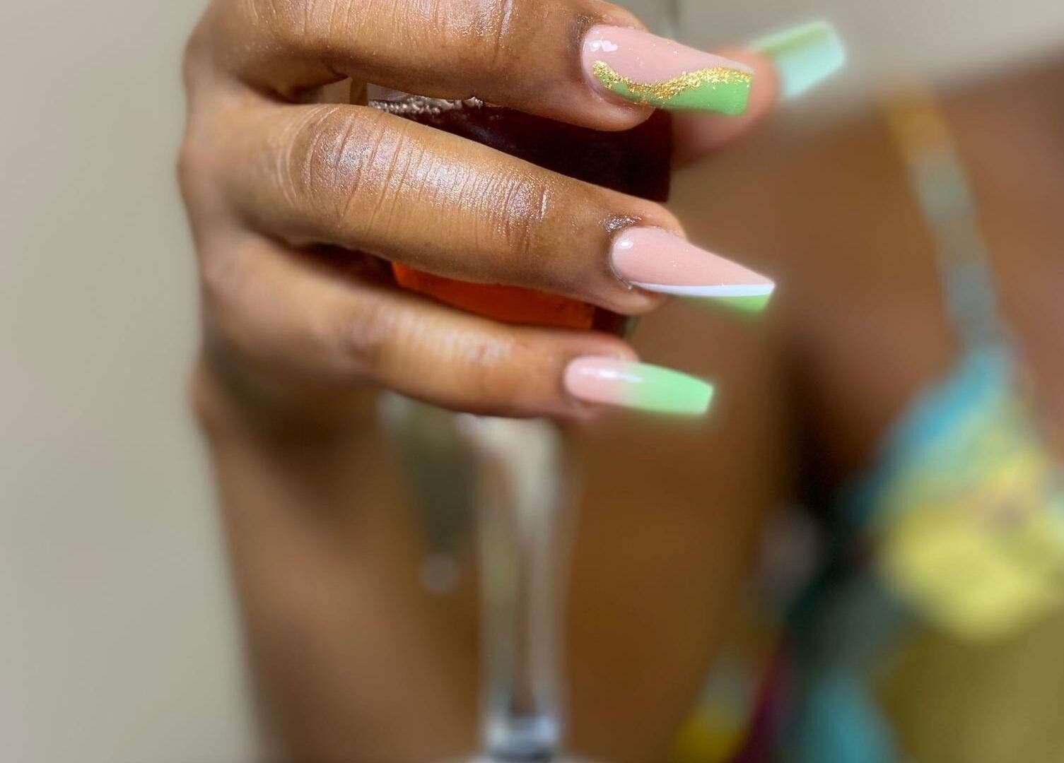 Elegant nail art at Ronexe Beauty Hub, Greater Accra Region, GH, featuring pastel and gold accents.