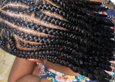 Intricate braided hairstyle at Xtra Touch Oasis, Scarborough, Tobago, TT. Perfect for a stunning look.
