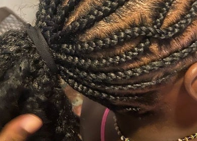 Intricate braided hairstyle at Xtra Touch Oasis, Scarborough, Tobago, TT, showcasing local artistry.