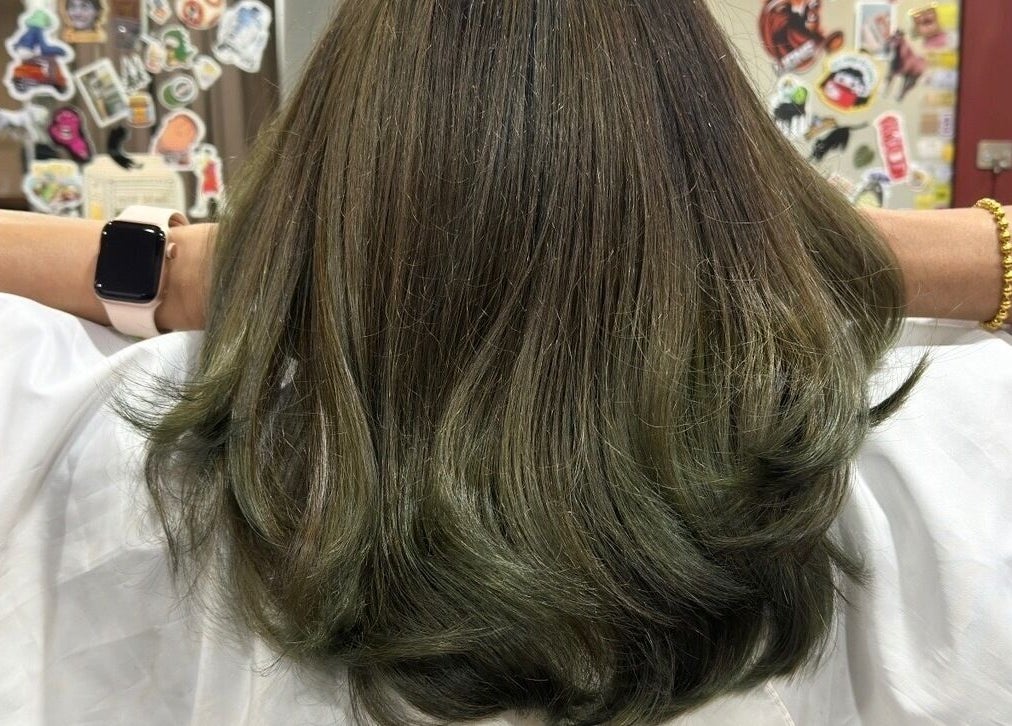 Fresh green-tinted hairstyle at Teera Hair Touch, Petaling Jaya, Selangor, MY, showcasing clean and vibrant waves.