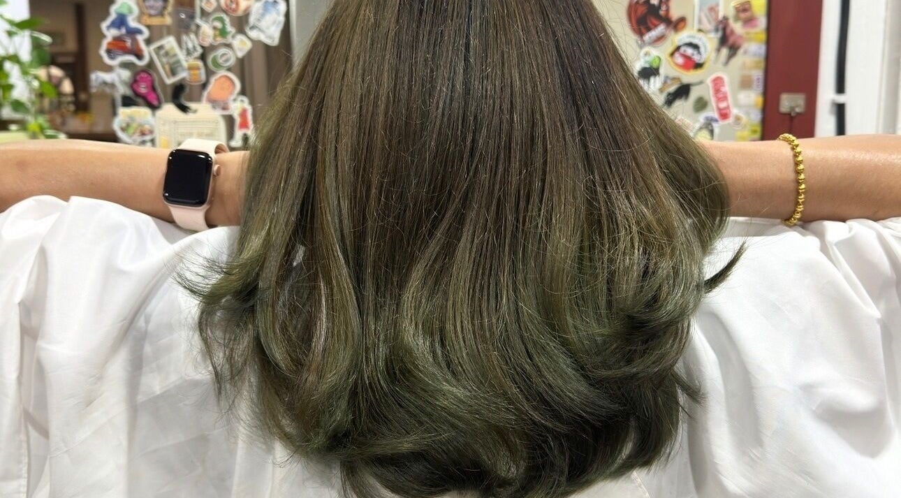 Fresh green-tinted hairstyle at Teera Hair Touch, Petaling Jaya, Selangor, MY, showcasing clean and vibrant waves.