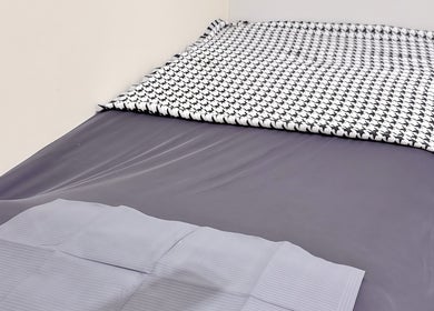 Cozy treatment bed at LynnStudiosg, Singapore, Singapore, SG, ready for a relaxing wellness session.