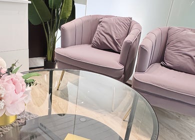 Chic lounge area with pink chairs and floral decor at LynnStudiosg, Singapore, Singapore, SG.