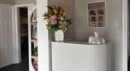 Reception area of The Beauty Spot - Rotherham, showcasing elegant decor and floral arrangement in Rotherham, England, GB.