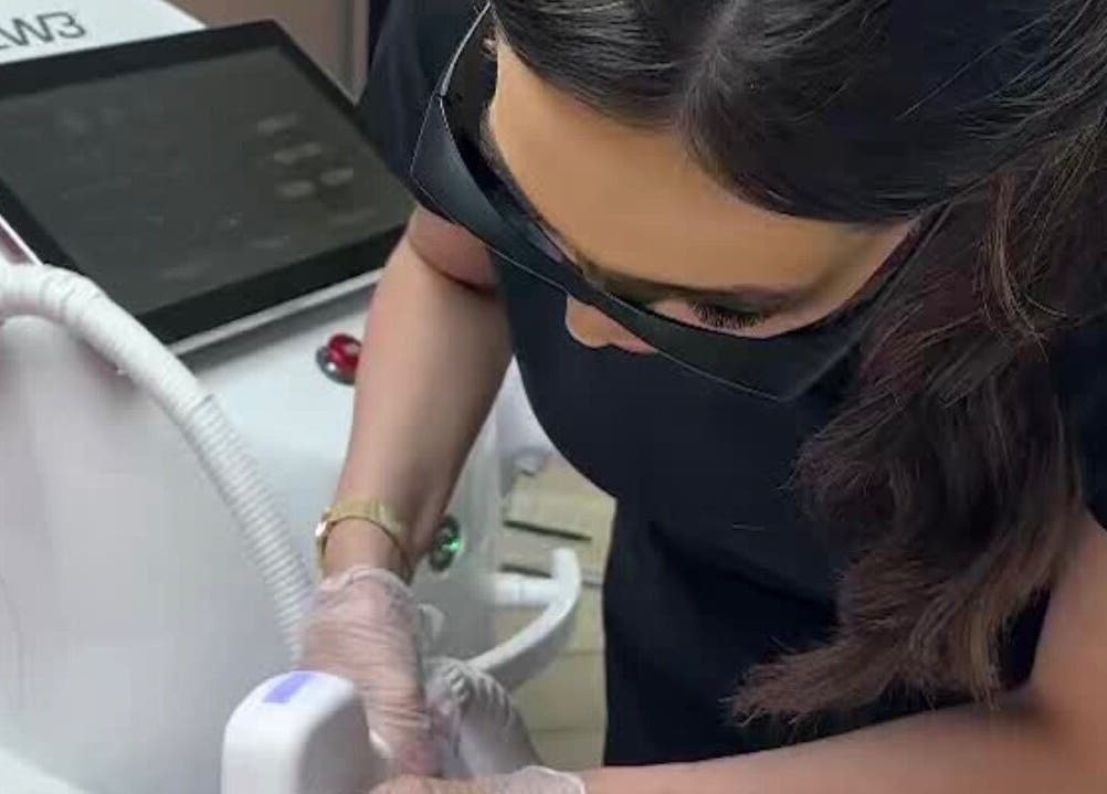 Technician performing laser treatment at Radiance Laser Studio, Aberdeen, Scotland, GB.