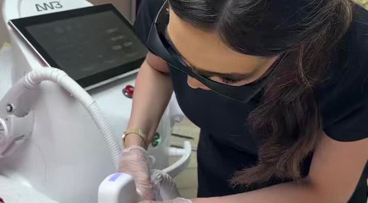 Technician performing laser treatment at Radiance Laser Studio, Aberdeen, Scotland, GB.