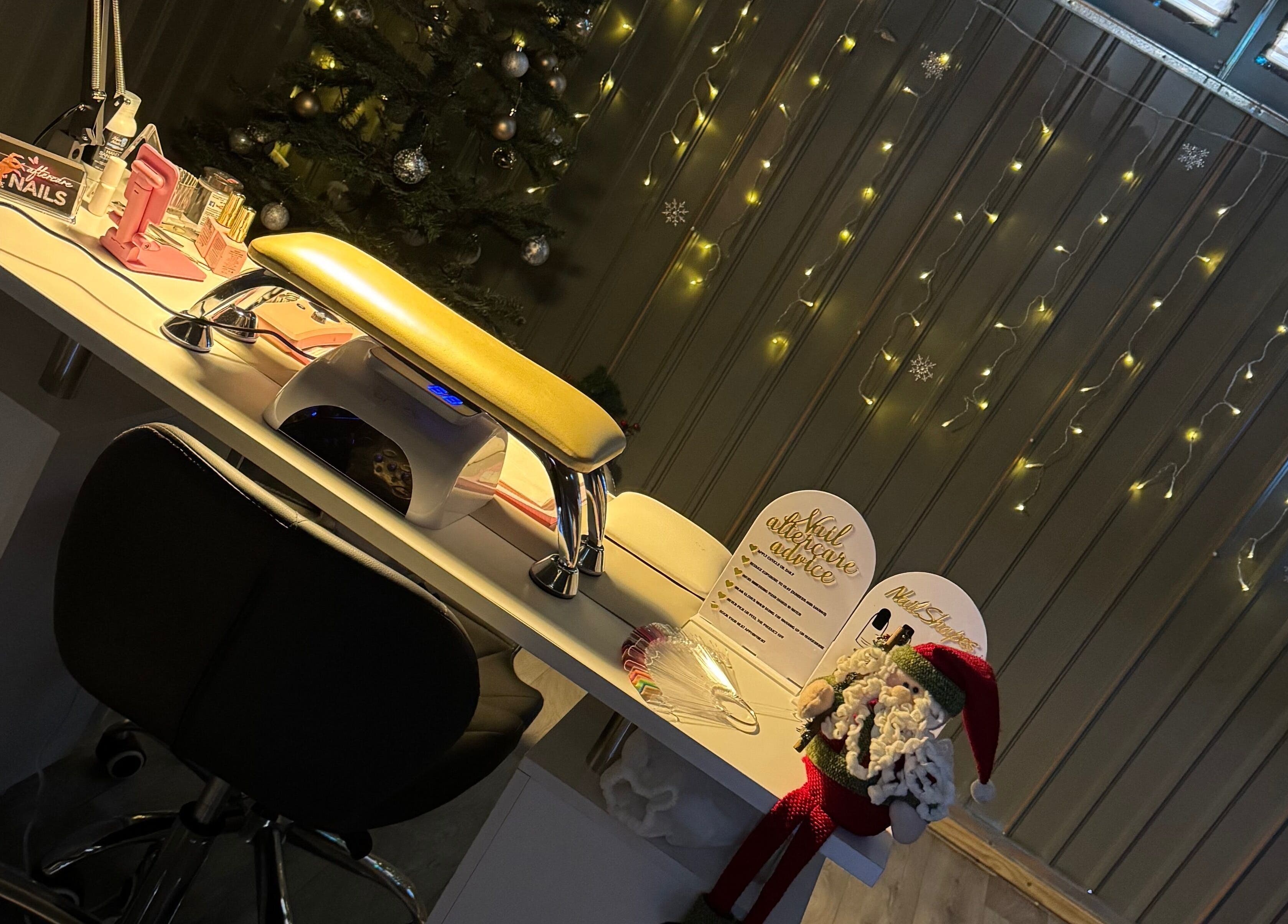 Nail station at Ambersbeautyx, Stoke-on-Trent, England, GB decorated for festive season.