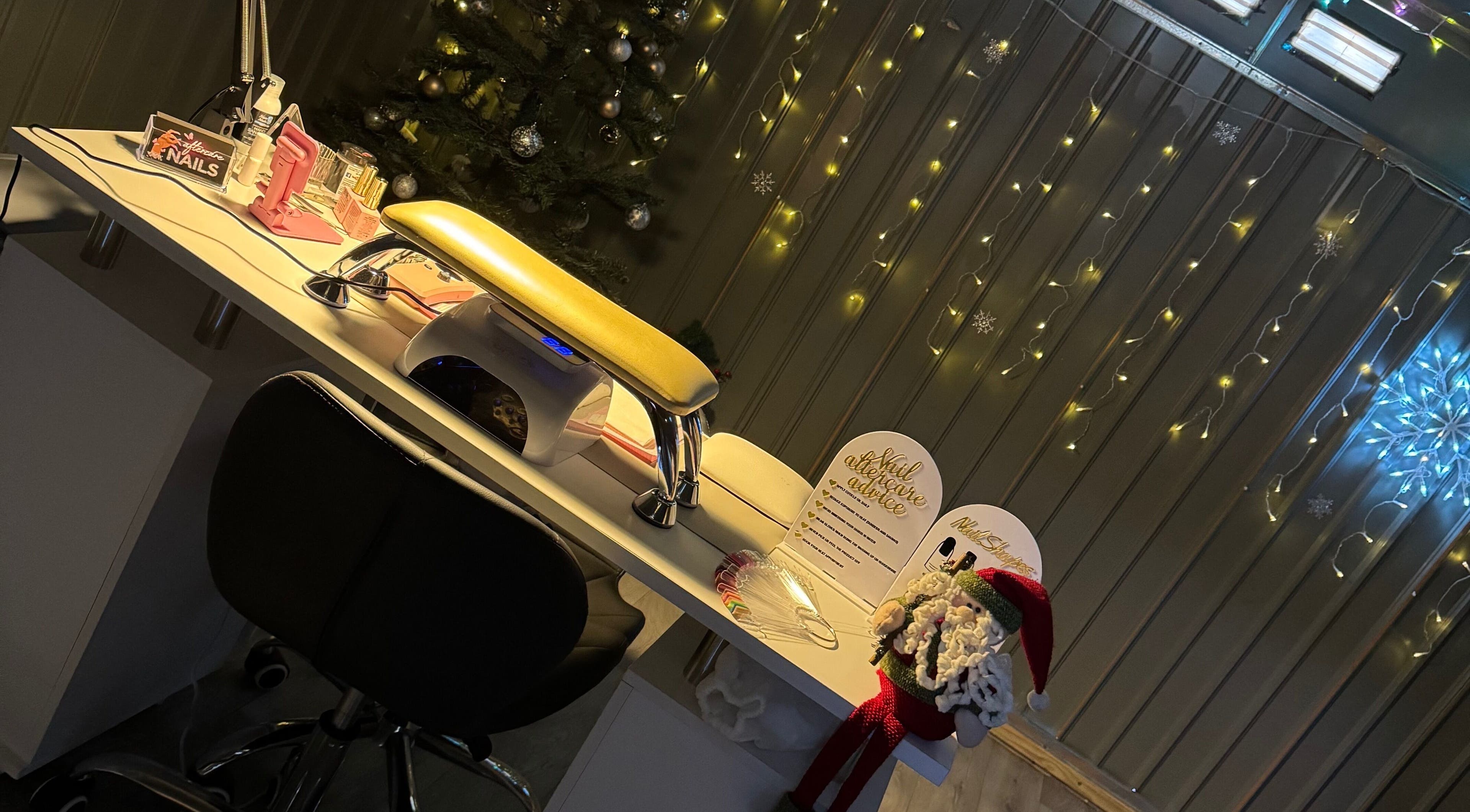 Nail station at Ambersbeautyx, Stoke-on-Trent, England, GB decorated for festive season.