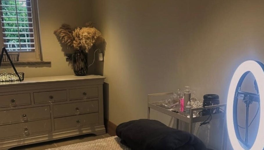 Serene treatment room at Bloom Beauty on The Quays, Salford, England, GB with soft lighting and elegant decor.