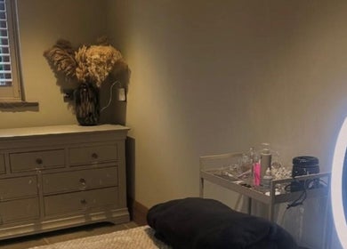 Serene treatment room at Bloom Beauty on The Quays, Salford, England, GB with soft lighting and elegant decor.