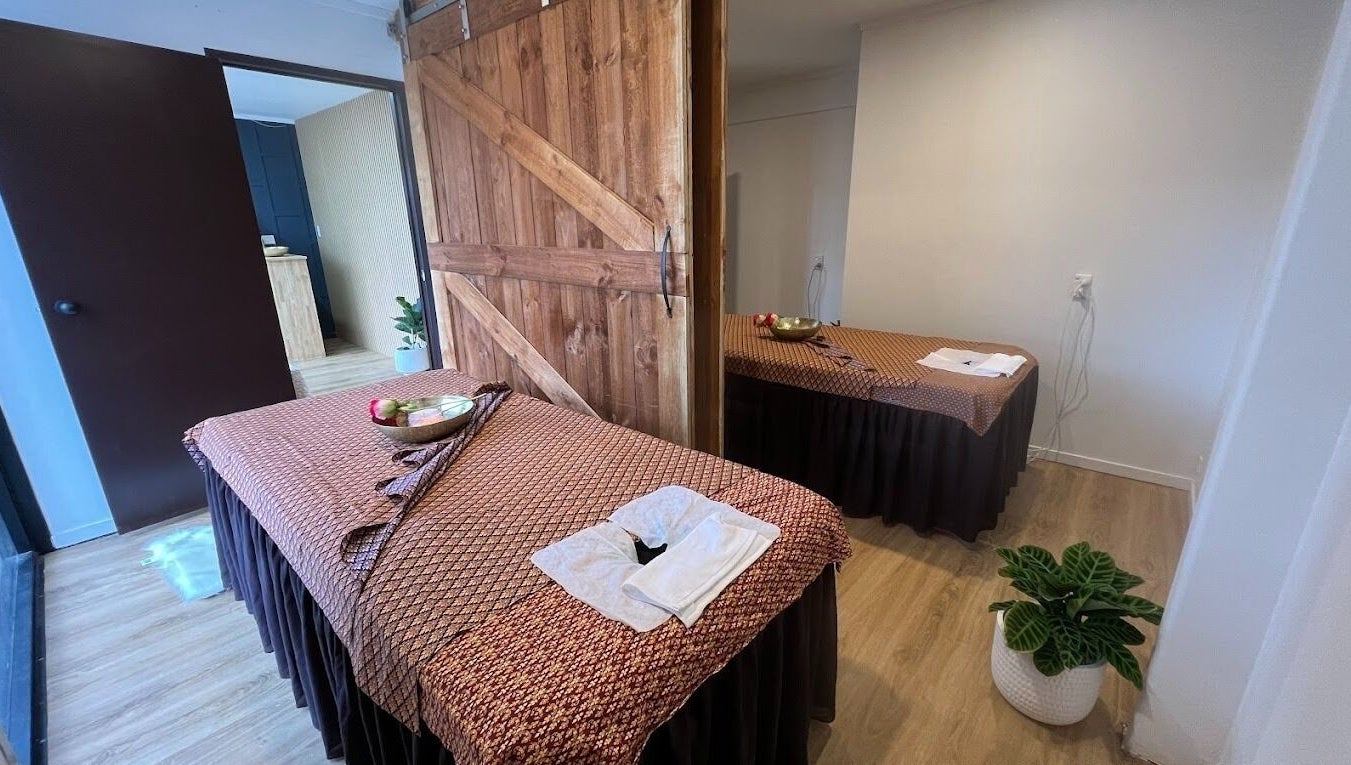Peaceful massage room at Sanctuary Glenfield in Auckland, NZ, featuring serene decor and relaxation setup.
