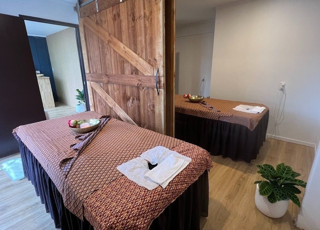 Peaceful massage room at Sanctuary Glenfield in Auckland, NZ, featuring serene decor and relaxation setup.