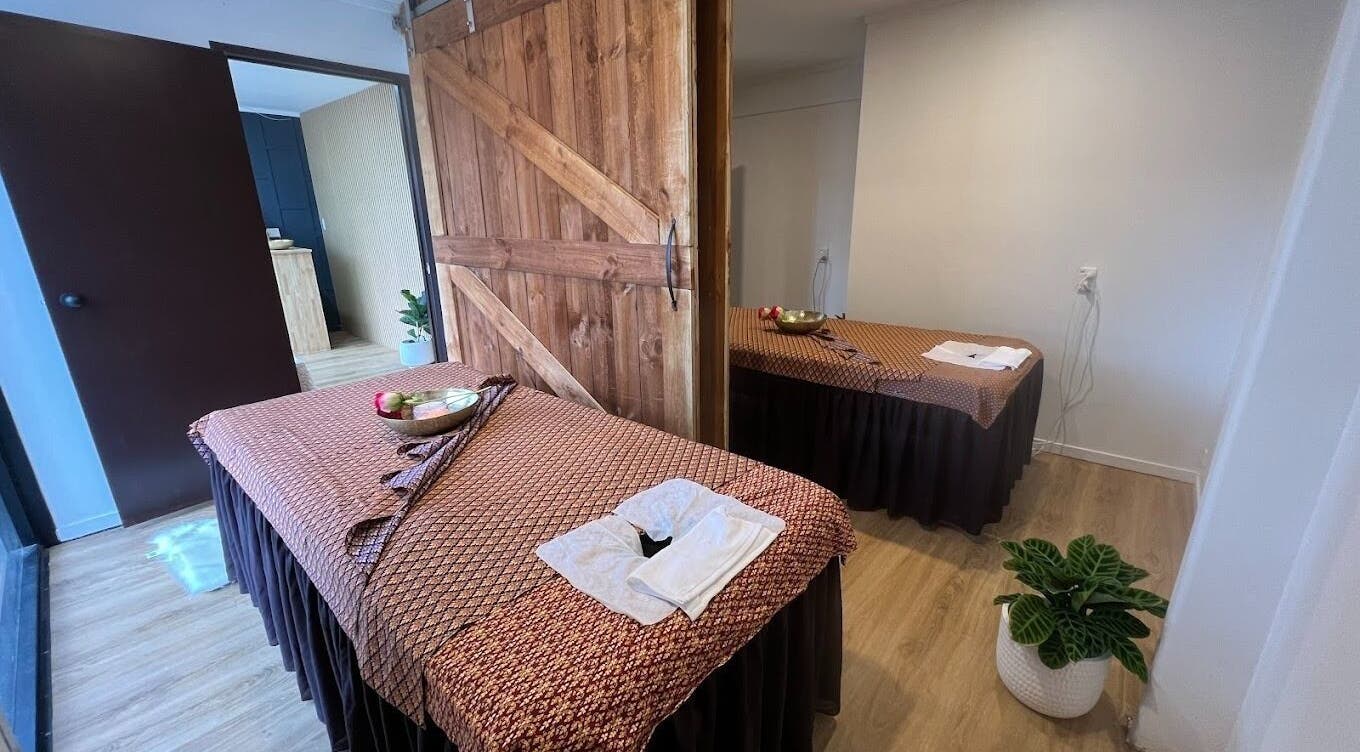 Peaceful massage room at Sanctuary Glenfield in Auckland, NZ, featuring serene decor and relaxation setup.